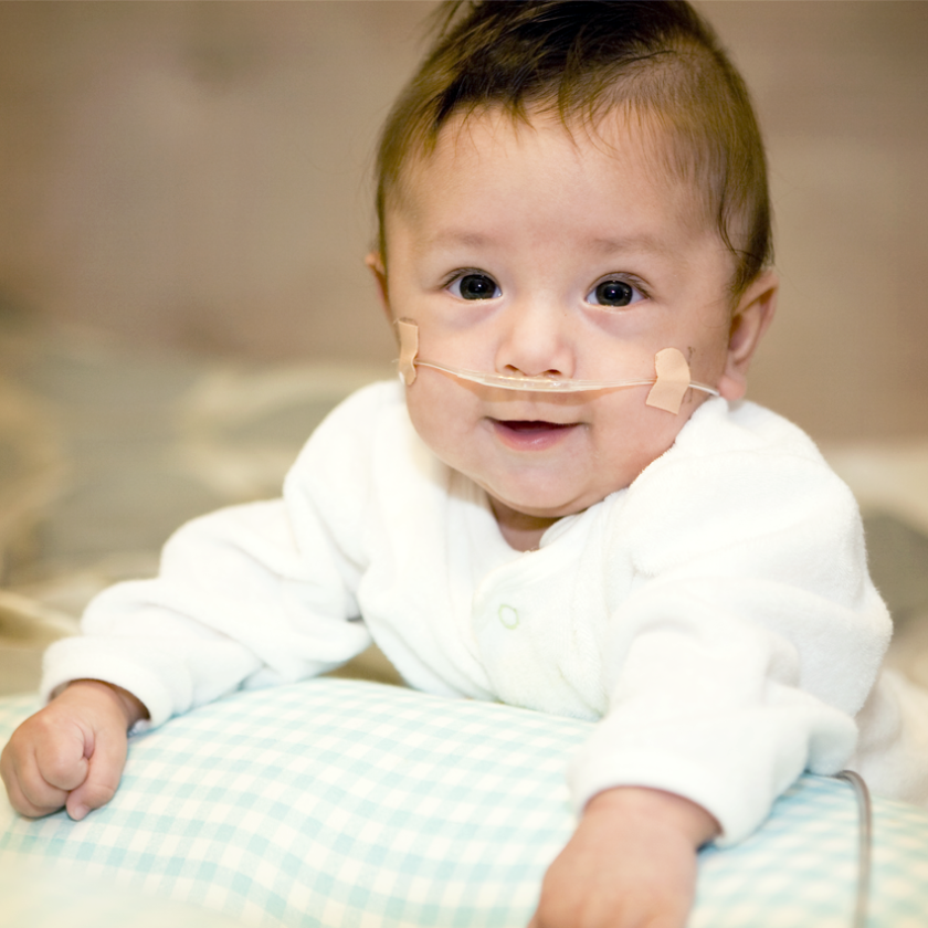 Happy baby with medical needs