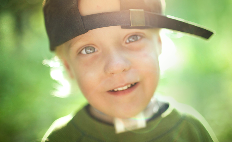 Boy with tracheotomy smiling