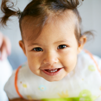 A young girl smiling