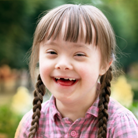 Girl with down syndrome smiling